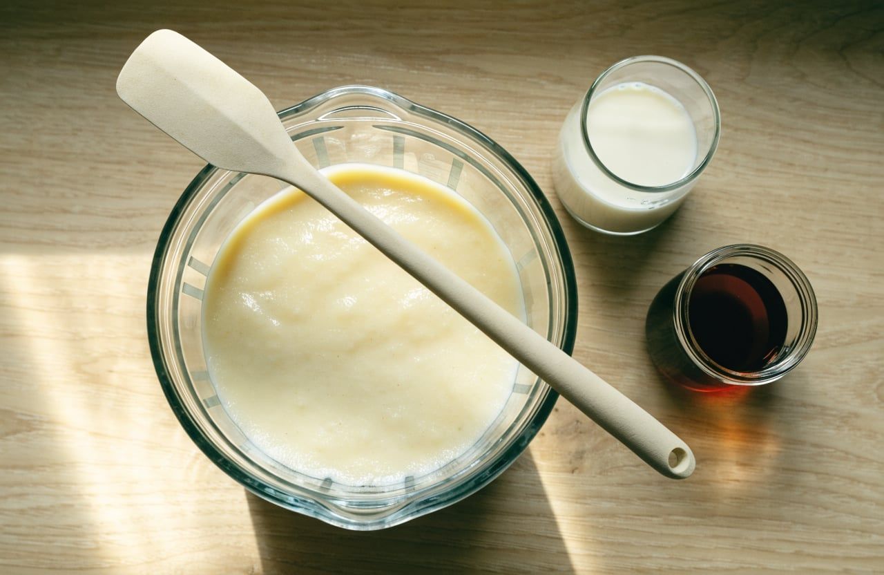 Blender jar with thick, smooth ivory cottage cheese ice cream base and no visible curds