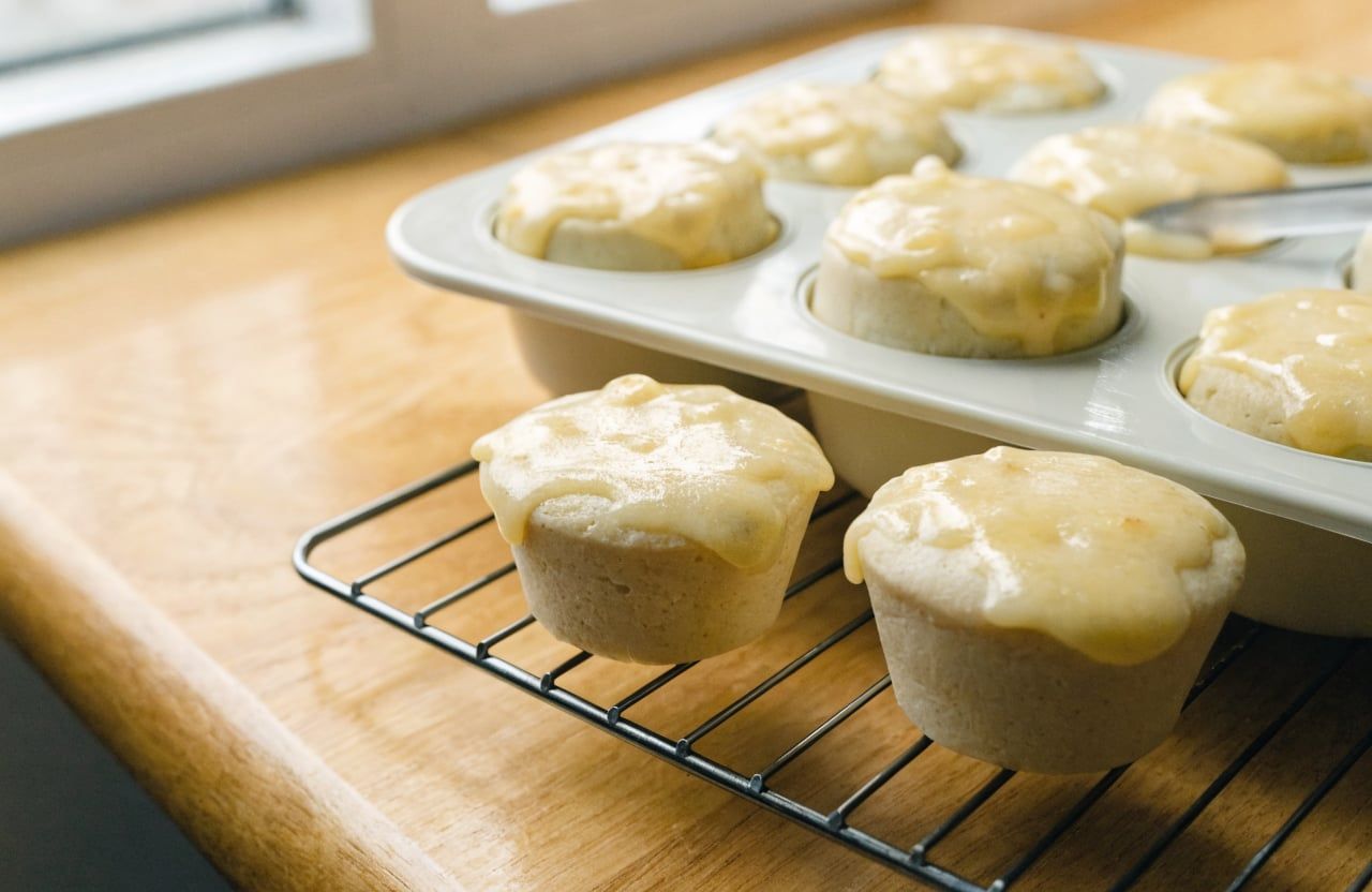 Baked egg bites released from a silicone muffin pan, smooth pale sides and matte tops